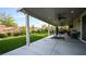 Enjoy the outdoors on the covered patio with ceiling fans, ample seating, and a view of the lush backyard at 2913 Monate Ct, Henderson, NV 89044