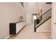 Welcoming foyer with staircase, neutral color palette, and elegant decor at 2913 Monate Ct, Henderson, NV 89044