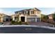 Two-story home showcasing a three-car garage and a well-maintained front yard with manicured landscaping at 2913 Monate Ct, Henderson, NV 89044