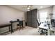 Home office featuring neutral walls, a window with shutters, custom panel accent and a work area with multiple desks at 2913 Monate Ct, Henderson, NV 89044
