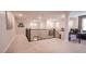 Spacious landing featuring neutral tones, plush carpet, an iron railing, and an adjacent desk area at 2913 Monate Ct, Henderson, NV 89044