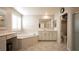 Bright and spacious main bathroom with dual vanities, a soaking tub, and separate shower stall at 2913 Monate Ct, Henderson, NV 89044