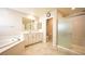 Well-lit main bathroom with soaking tub, separate shower, and plenty of cabinet space at 2913 Monate Ct, Henderson, NV 89044