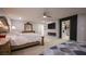 Opulent main bedroom featuring an electric fireplace, decorative wall panel, and walk-in closet at 2913 Monate Ct, Henderson, NV 89044