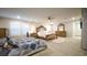 Large main bedroom with abundant light, ceiling fan, and view into the bathroom and closet at 2913 Monate Ct, Henderson, NV 89044