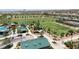 Aerial view showcasing a park with green space, playground, covered picnic areas, and walking trails at 2913 Monate Ct, Henderson, NV 89044