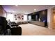 Spacious theater room with plush seating, a large screen, and cozy beanbag chairs at 2913 Monate Ct, Henderson, NV 89044