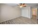 Bedroom featuring a ceiling fan, laminate flooring and closet at 3060 Tarpon Dr # 102, Las Vegas, NV 89120