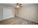 Bedroom featuring a ceiling fan, laminate flooring and closet at 3060 Tarpon Dr # 102, Las Vegas, NV 89120