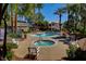 Resort-style community pool and spa surrounded by lush landscaping at 3060 Tarpon Dr # 102, Las Vegas, NV 89120