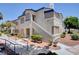Inviting two-story apartment building with walkways, stairs, and well-maintained landscaping under a clear sky at 3060 Tarpon Dr # 102, Las Vegas, NV 89120