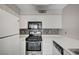 This compact kitchen is equipped with sleek, stainless steel appliances and contrasting backsplash at 3060 Tarpon Dr # 102, Las Vegas, NV 89120