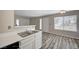 Open floor plan features kitchen with stainless steel sink and modern white countertops at 3060 Tarpon Dr # 102, Las Vegas, NV 89120