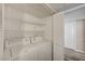 Convenient laundry area with washer, dryer, and shelving at 3060 Tarpon Dr # 102, Las Vegas, NV 89120