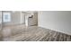 Open-concept living room showcasing wood-look floors and access to the kitchen at 3060 Tarpon Dr # 102, Las Vegas, NV 89120