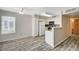 Cozy living room and kitchen space with wood-look flooring and natural light at 3060 Tarpon Dr # 102, Las Vegas, NV 89120