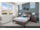 Serene secondary bedroom with natural light, a full bed, and a calming color scheme at 314 S Parawan St # Lot 13, Henderson, NV 89015