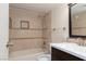 Bathroom showcasing a shower and bath with light brown tiling at 3189 Pinehurst Dr # B, Las Vegas, NV 89109