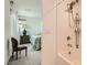 Modern bathroom featuring a shower/tub and view into the bedroom at 3194 Lumassina Way, Henderson, NV 89044