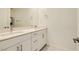Modern bathroom featuring a dual sink vanity with sleek fixtures and ample storage space at 3194 Lumassina Way, Henderson, NV 89044
