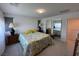 Bedroom with a large bed, neutral walls, and ample natural light at 3194 Lumassina Way, Henderson, NV 89044