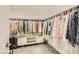 Walk-in closet filled with clothes and a center organizer, perfect for storage and organization at 3194 Lumassina Way, Henderson, NV 89044