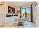 Stylish breakfast nook featuring natural light, outdoor views, and access to the backyard patio at 3194 Lumassina Way, Henderson, NV 89044