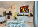 Eat-in kitchen area with modern table, chairs, and artistic decor against white cabinetry at 3194 Lumassina Way, Henderson, NV 89044