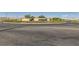 A roundabout entrance into the Inspira community with desert landscaping and a large entrance sign at 3194 Lumassina Way, Henderson, NV 89044