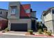 Modern two-story home with attached garage and contemporary design elements at 3194 Lumassina Way, Henderson, NV 89044