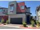 Modern two-story home with attached garage and contemporary design elements at 3194 Lumassina Way, Henderson, NV 89044