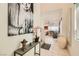 Spacious hallway with access to the living room and staircase, adorned with modern décor and tile flooring at 3194 Lumassina Way, Henderson, NV 89044