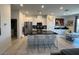 Open kitchen with stainless steel appliances and dark countertops at 3194 Lumassina Way, Henderson, NV 89044