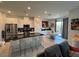Open kitchen with stainless steel appliances and dark countertops at 3194 Lumassina Way, Henderson, NV 89044