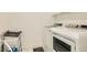 Bright laundry room features a modern washer and dryer set, plus plenty of space at 3194 Lumassina Way, Henderson, NV 89044