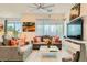 Inviting living room featuring modern decor, a large-screen TV, and a cozy seating area at 3194 Lumassina Way, Henderson, NV 89044