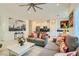 Spacious living area with tile flooring, open floorplan, and a view into the kitchen area at 3194 Lumassina Way, Henderson, NV 89044