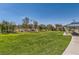 Beautiful park with lush green grass, mature trees, and a covered picnic area for community residents to enjoy at 3194 Lumassina Way, Henderson, NV 89044