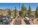 Brick patio area featuring comfortable outdoor seating, plants, and a privacy wall at 3194 Lumassina Way, Henderson, NV 89044