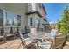 Outdoor brick patio featuring landscaping, dining, lounge seating, and modern design at 3194 Lumassina Way, Henderson, NV 89044