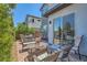 Outdoor seating area on a brick patio with easy access to the home's interior at 3194 Lumassina Way, Henderson, NV 89044