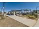 Community picnic area with a covered pavilion, picnic tables, and barbecue grills at 3194 Lumassina Way, Henderson, NV 89044