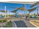 Community playground featuring modern play equipment, sunshades, and soft fall ground covering at 3194 Lumassina Way, Henderson, NV 89044