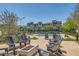 Community pool with lounge chairs and umbrellas for relaxing outdoor enjoyment at 3194 Lumassina Way, Henderson, NV 89044