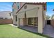 Backyard featuring a covered patio and artificial turf at 348 Andy Wheeler Dr, Henderson, NV 89011