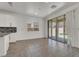 Bright dining area featuring tile floors and sliding glass doors to backyard at 348 Andy Wheeler Dr, Henderson, NV 89011