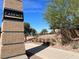 Community entrance sign reading 'Cadence the rhythm of a new day' with lush landscaping and a clear blue sky at 348 Andy Wheeler Dr, Henderson, NV 89011