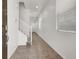 Bright entryway with tile flooring, staircase, and natural light streaming through the windows at 348 Andy Wheeler Dr, Henderson, NV 89011