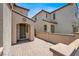Inviting entryway, featuring a neutral color scheme and paved walkway to the front door at 348 Andy Wheeler Dr, Henderson, NV 89011