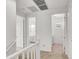 Hallway leads to the bathroom and laundry room, featuring a neutral color scheme and a clean and functional layout at 348 Andy Wheeler Dr, Henderson, NV 89011